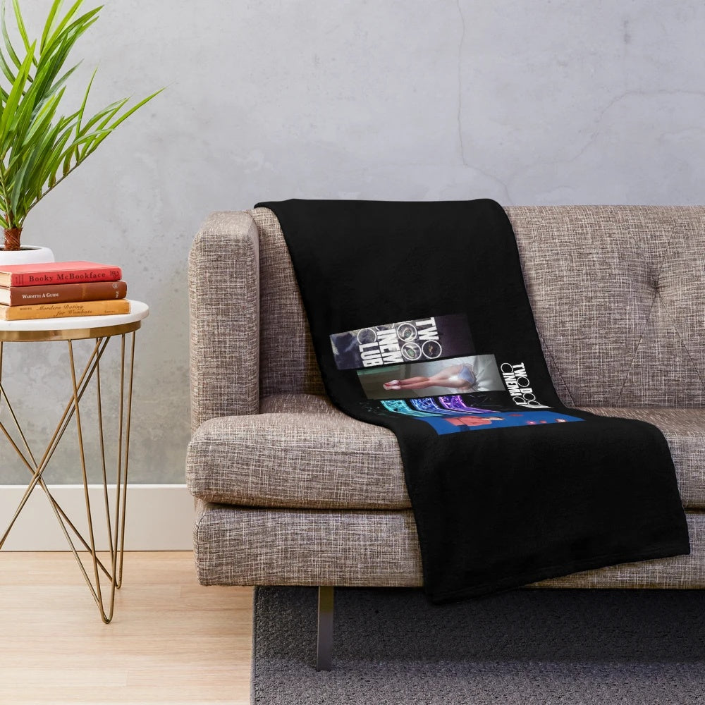 Plush blanket featuring the album covers of Two Door Cinema Club's discography