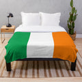 Soft and warm plush blanket featuring the iconic Irish flag design