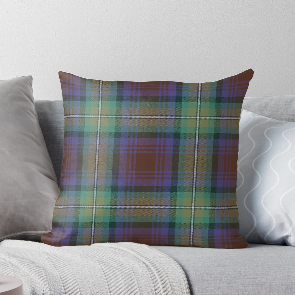 Soft, plaid pillow in shades of purple, green, and brown featuring the iconic Isle of Skye tartan pattern.