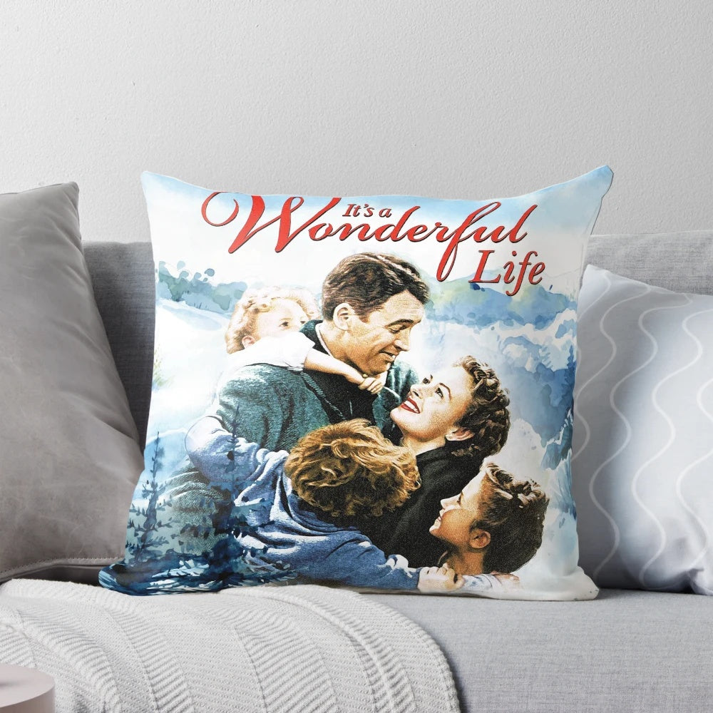 A vintage-inspired pillow featuring a snowy landscape scene from the classic film "It's a Wonderful Life"