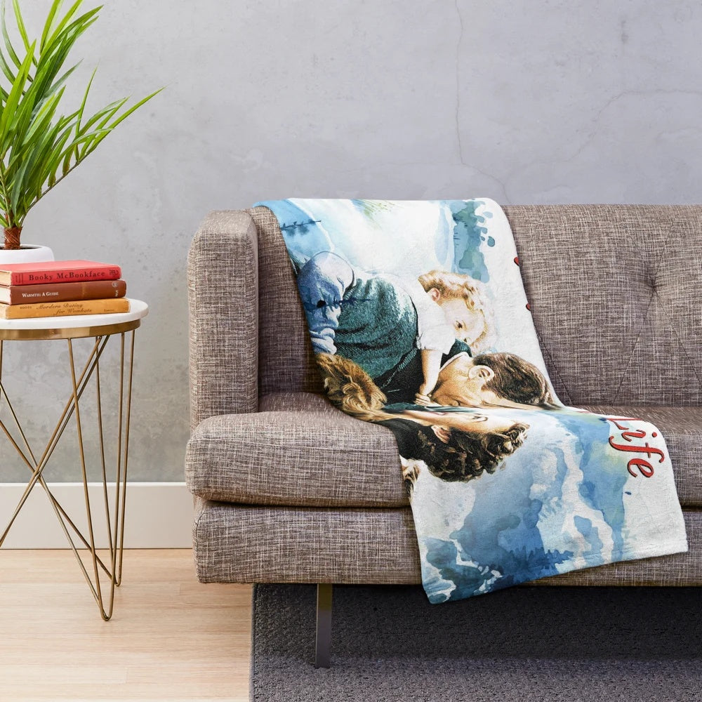 Plush blanket with a winter landscape scene inspired by the classic film It's a Wonderful Life