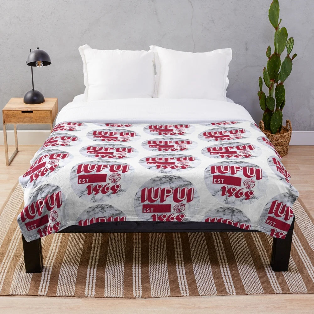 IUPUI-inspired plush blanket with a marble-like design in red and white