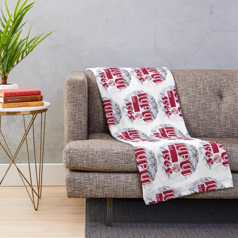 IUPUI-inspired plush blanket with a marble-like design in red and white