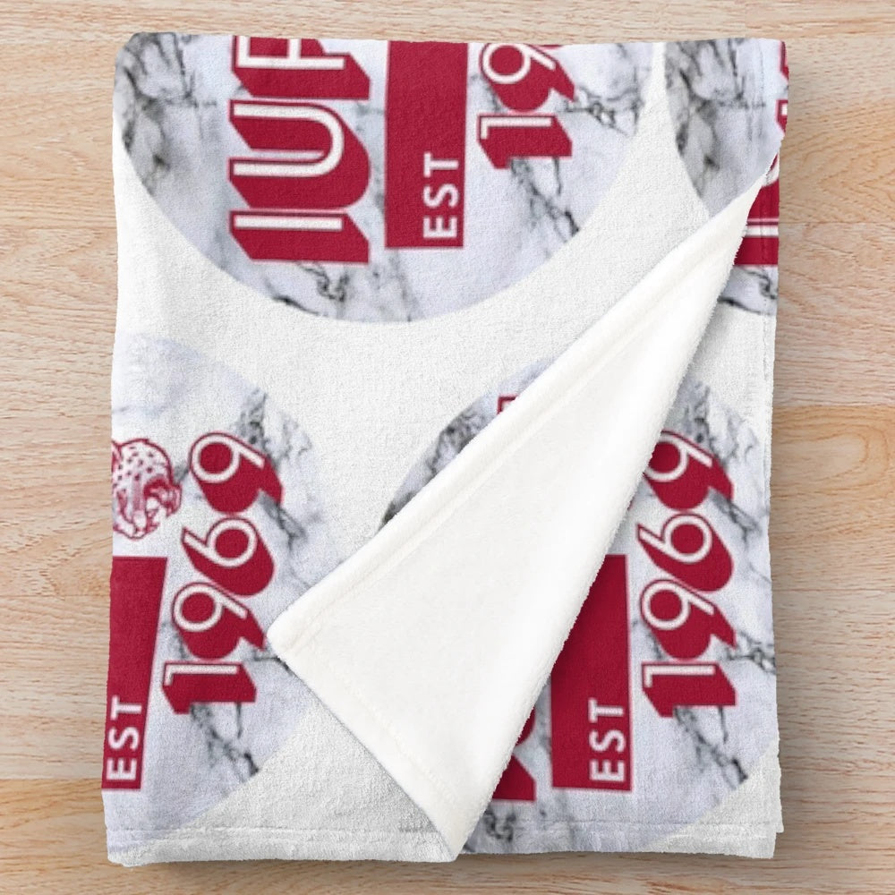 IUPUI-inspired plush blanket with a marble-like design in red and white