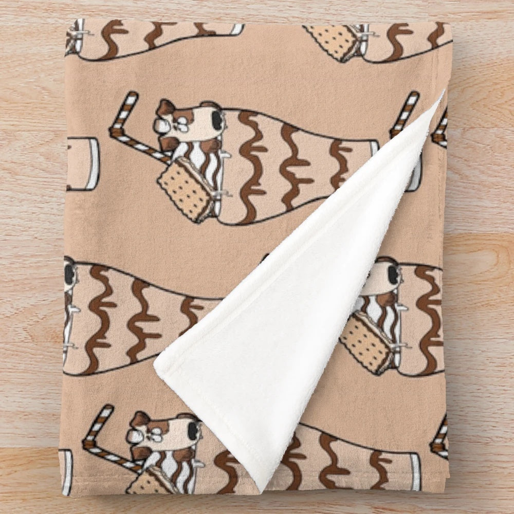 Jack Russell puppy on a plush s'mores milkshake themed blanket