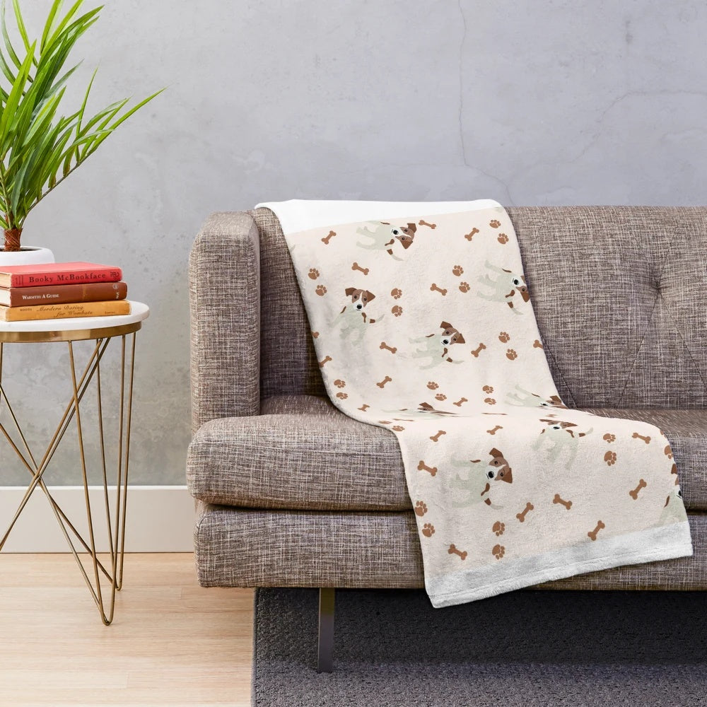 Jack Russell Terrier dog on a plush blanket