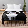 A cozy plush blanket featuring the character Jack Skellington from the movie The Nightmare Before Christmas