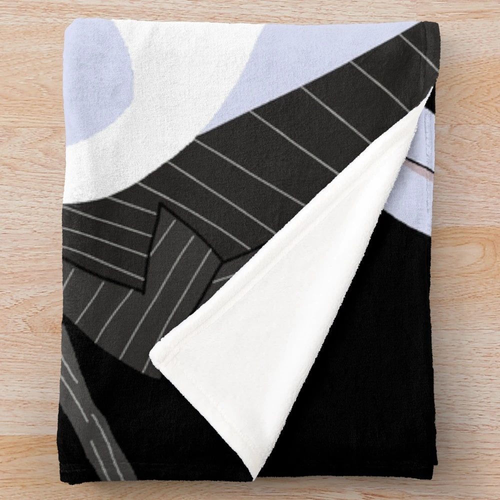 A cozy plush blanket featuring the character Jack Skellington from the movie The Nightmare Before Christmas