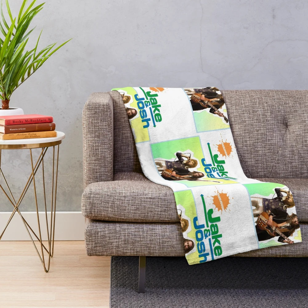 A plush blanket featuring the likenesses of Jake and Josh, inspired by popular culture