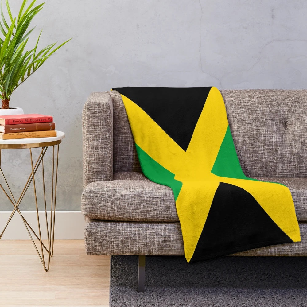 Plush blanket featuring the vibrant colors and design of the Jamaican national flag
