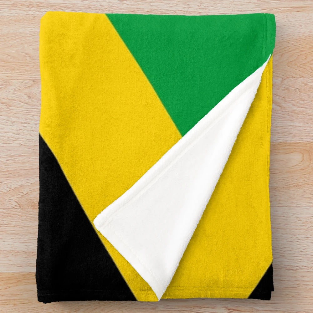Plush blanket featuring the vibrant colors and design of the Jamaican national flag