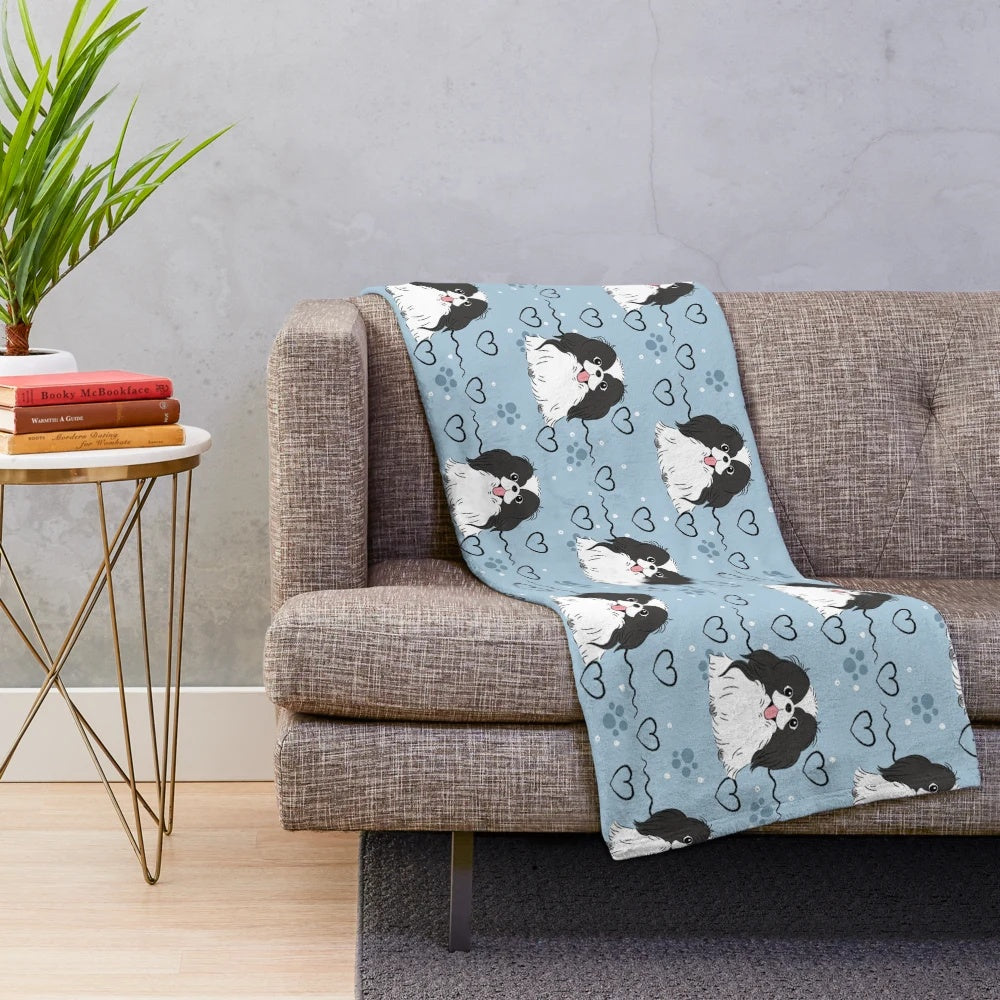 Soft and cuddly Japanese Chin plush blanket with a black and white dog pattern