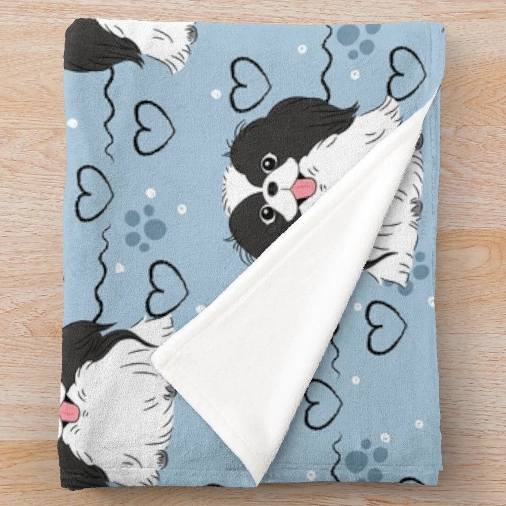 Soft and cuddly Japanese Chin plush blanket with a black and white dog pattern