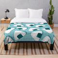 Soft and cuddly plush blanket with a Japanese onigiri food pattern design