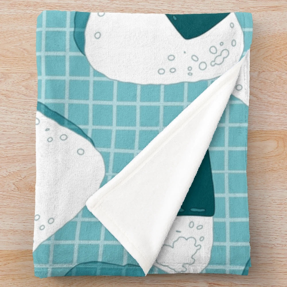 Soft and cuddly plush blanket with a Japanese onigiri food pattern design