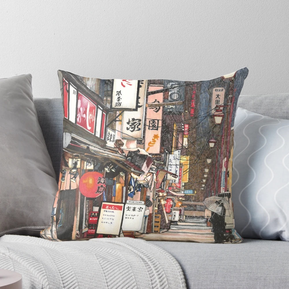 A plush pillow featuring a snowy Japanese city scene with red lanterns and lights against a night sky.