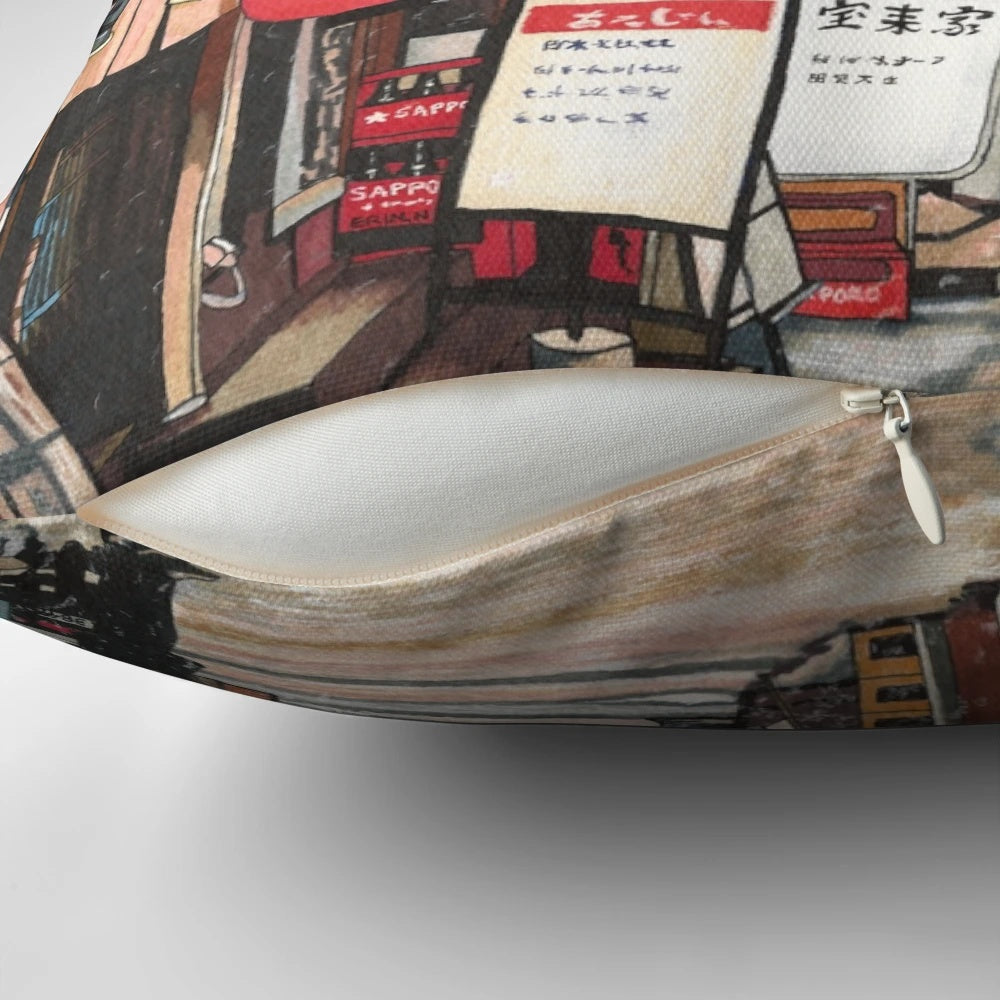 A plush pillow featuring a snowy Japanese city scene with red lanterns and lights against a night sky.