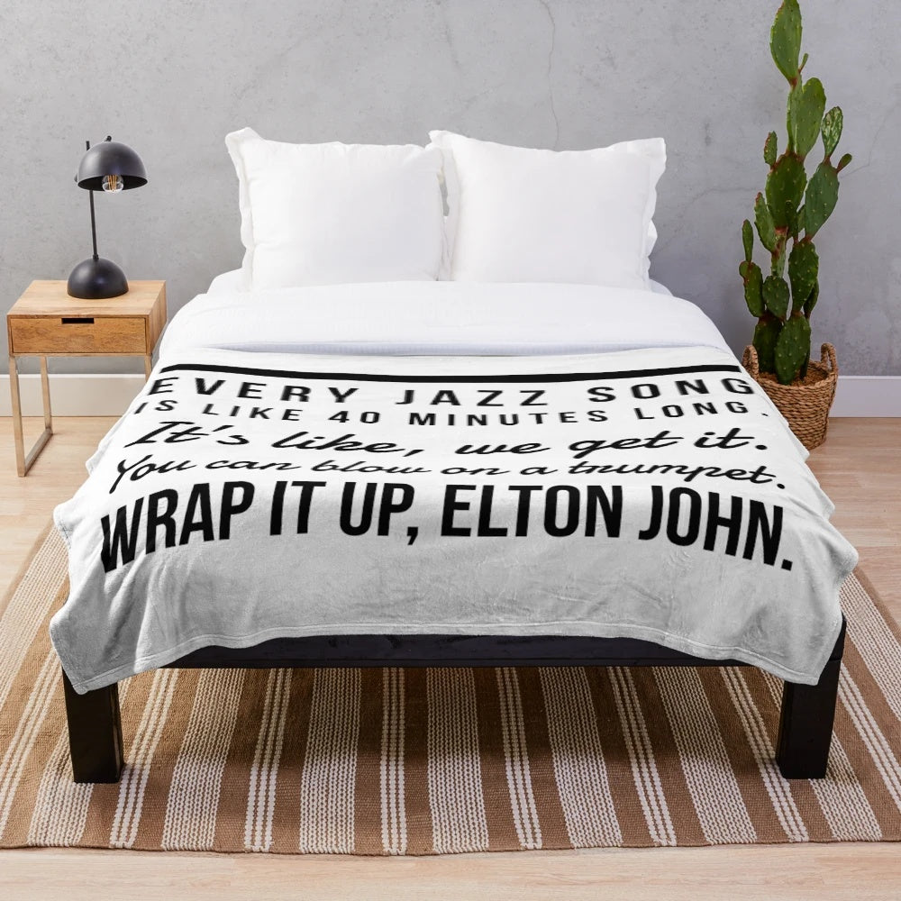 Cozy plush blanket featuring jazz-inspired typography and quotes