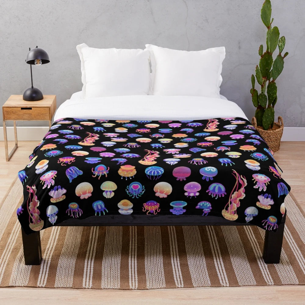 Jellyfish plush blanket featuring a variety of marine life designs