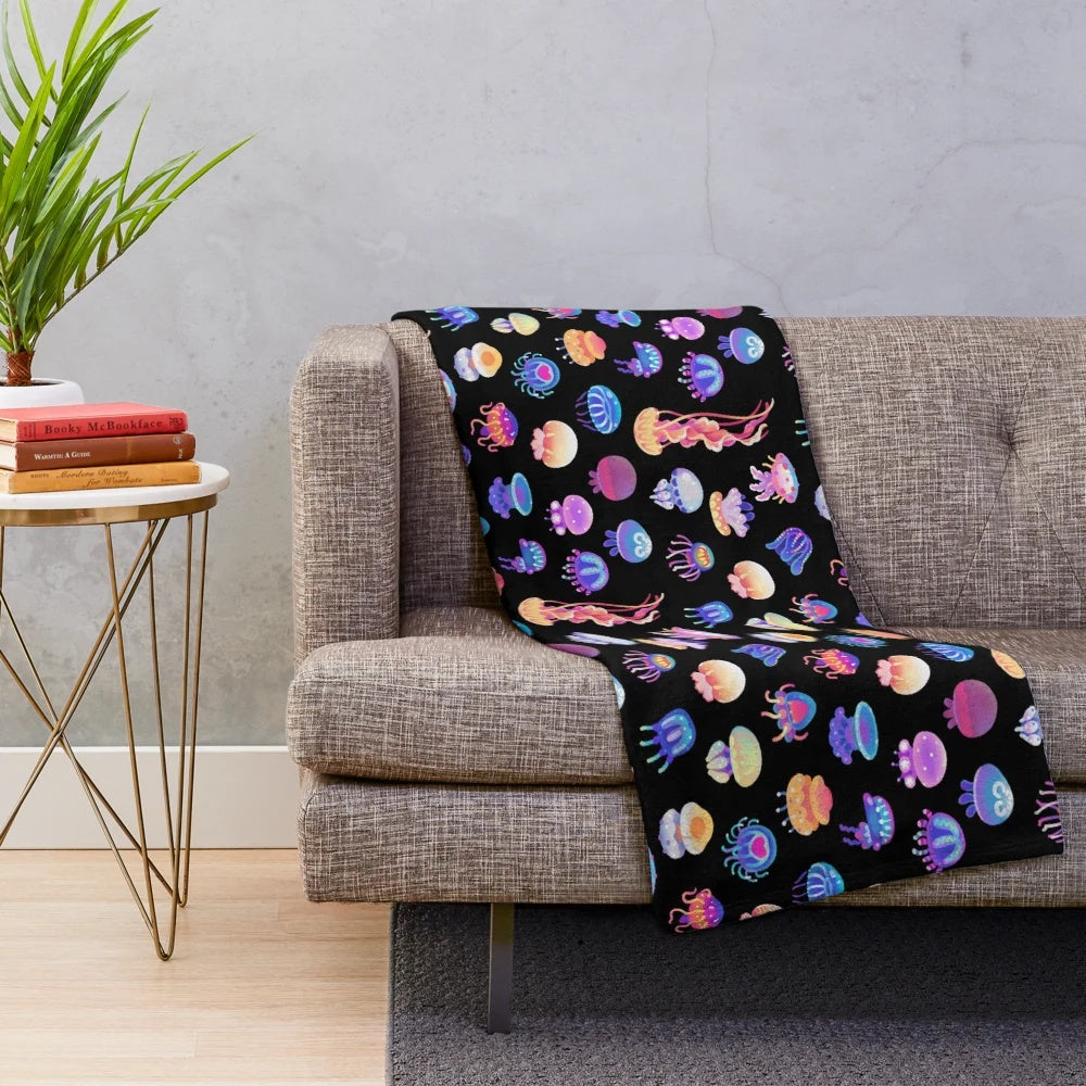 Jellyfish plush blanket featuring a variety of marine life designs