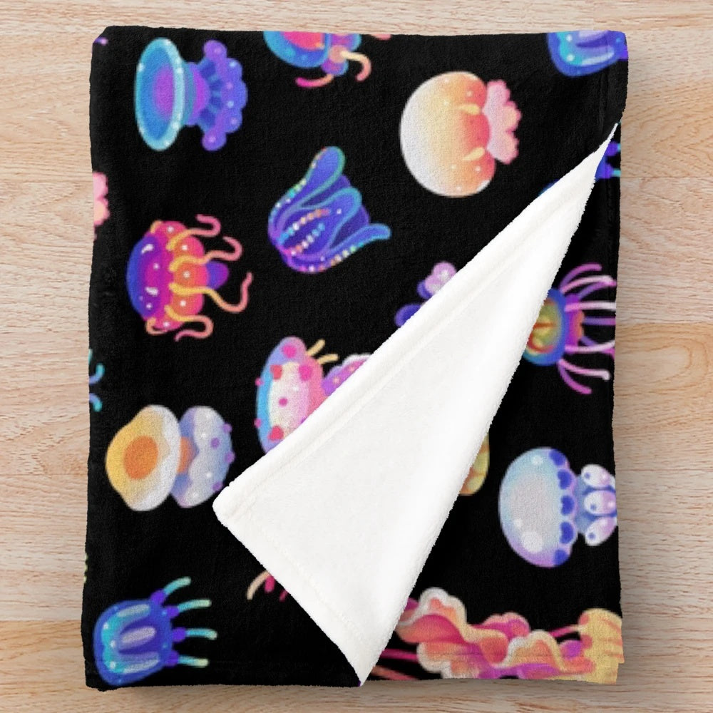Jellyfish plush blanket featuring a variety of marine life designs