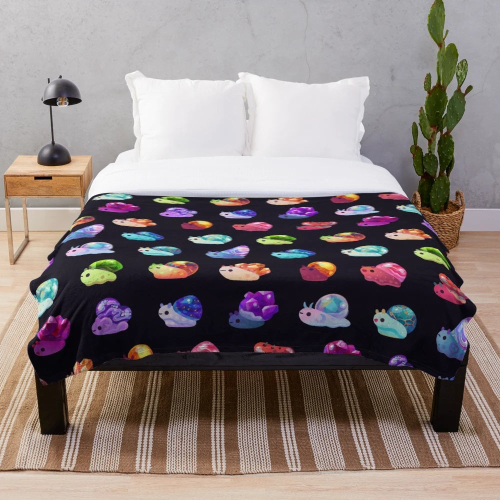 Cozy jewel snail plush blanket with colorful gemstone designs
