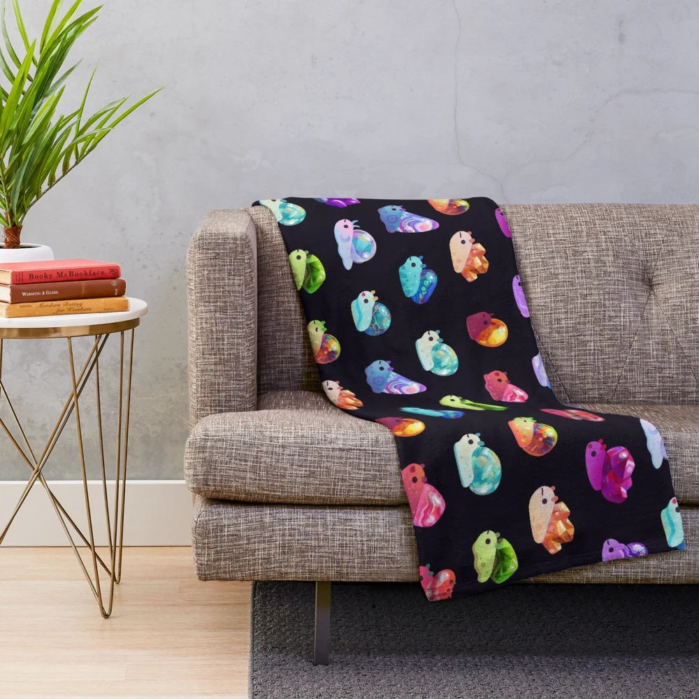 Cozy jewel snail plush blanket with colorful gemstone designs