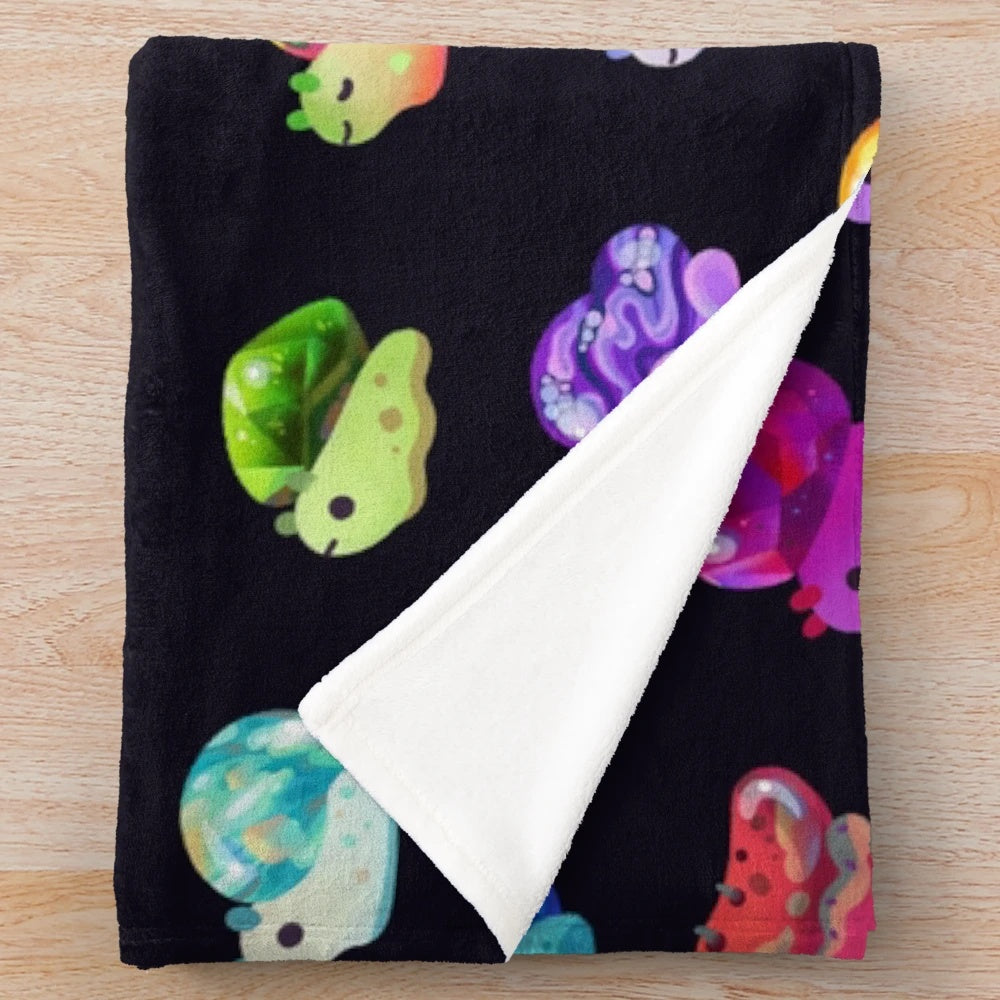 Cozy jewel snail plush blanket with colorful gemstone designs