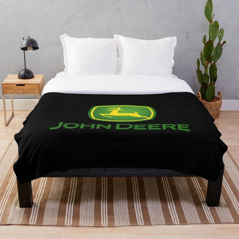 John Deere-inspired plush blanket with tractor and farm motifs