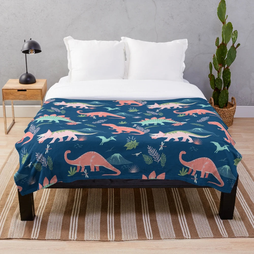 Jurassic dinosaur plush blanket in blue and coral colors