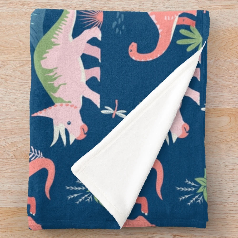 Jurassic dinosaur plush blanket in blue and coral colors