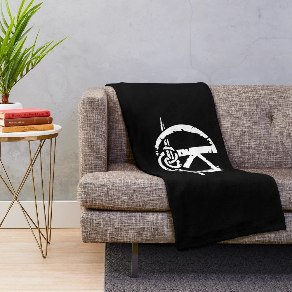 Kaamelott-inspired plush blanket featuring the logo and characters from the popular French TV series