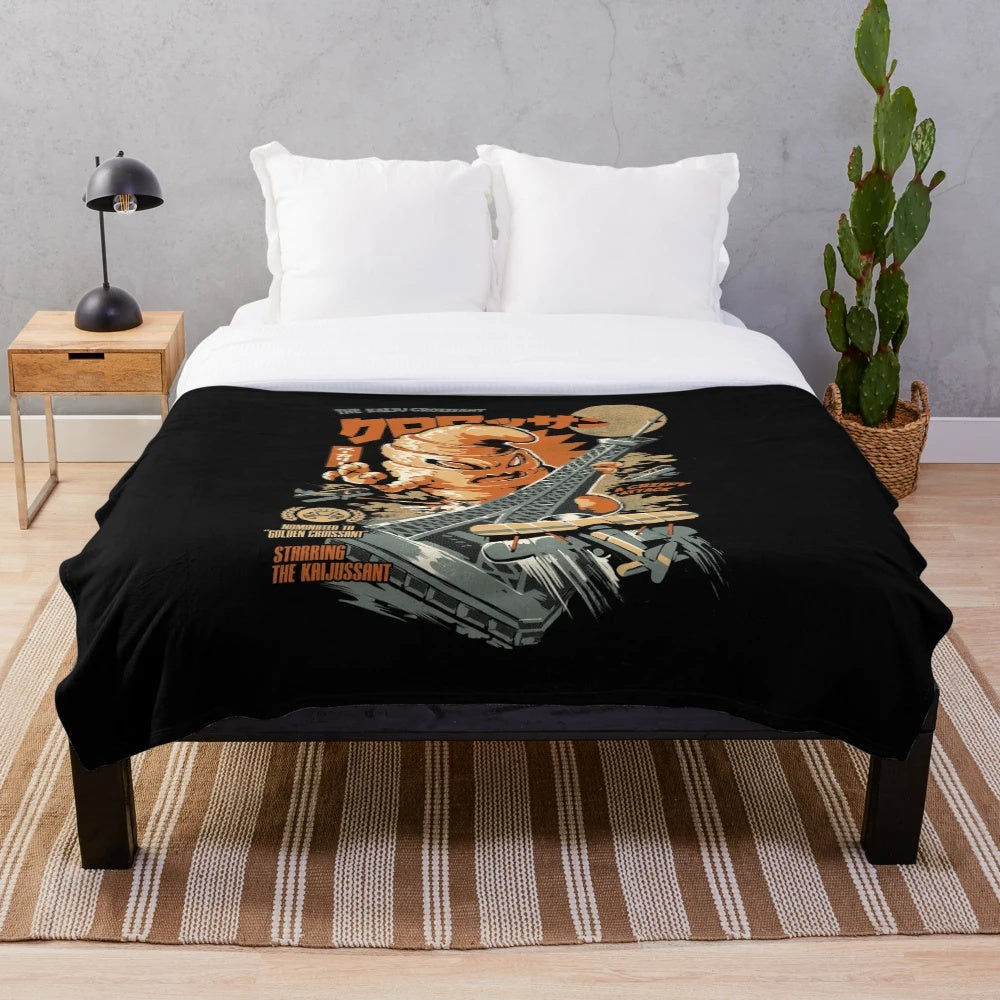 Plush blanket featuring a kaiju-inspired croissant design