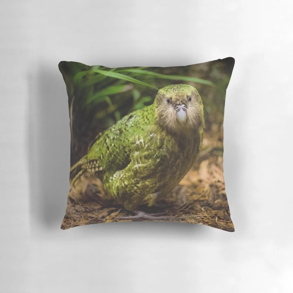 Soft, plush pillow featuring a detailed illustration of the endangered Kakapo parrot native to New Zealand.