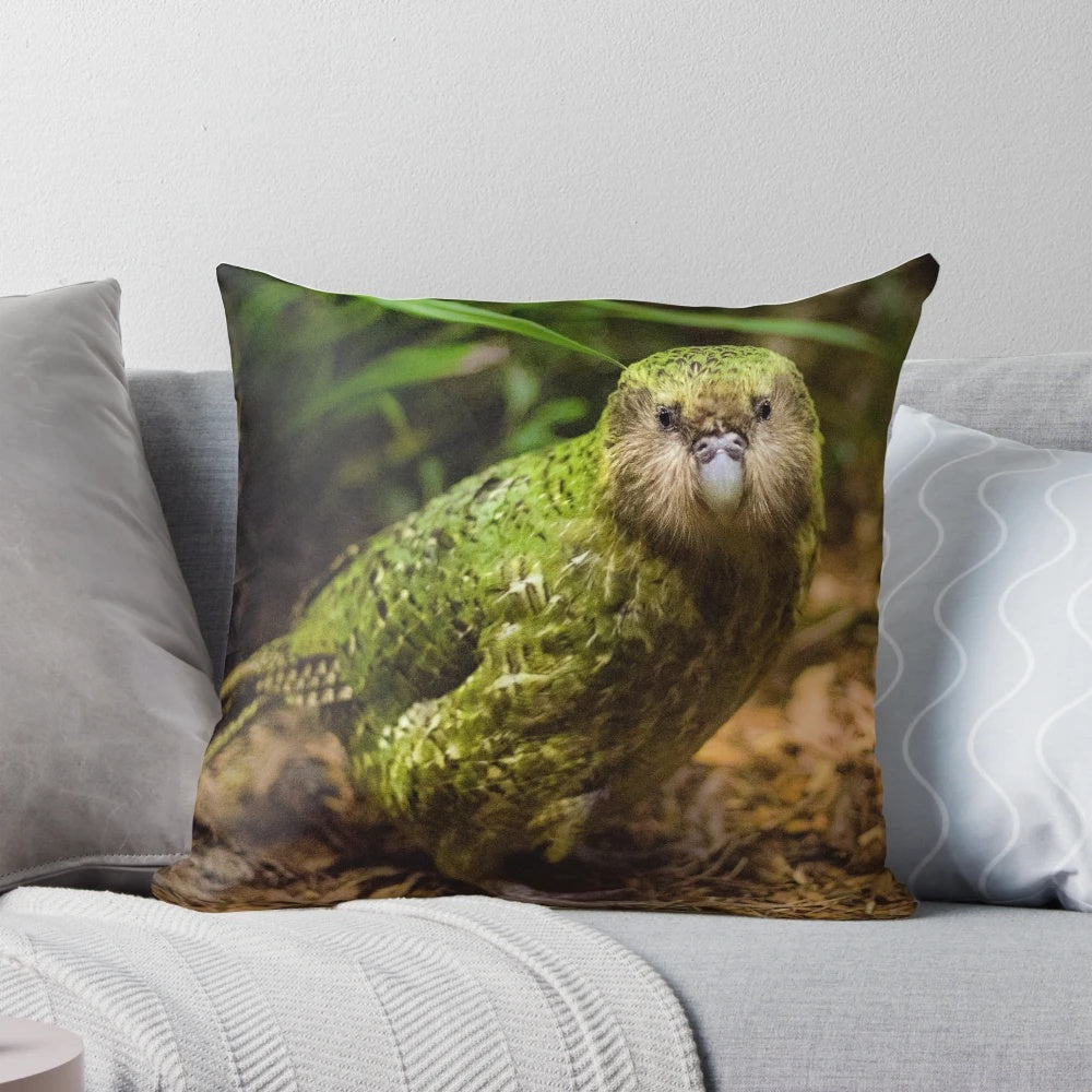 Soft, plush pillow featuring a detailed illustration of the endangered Kakapo parrot native to New Zealand.