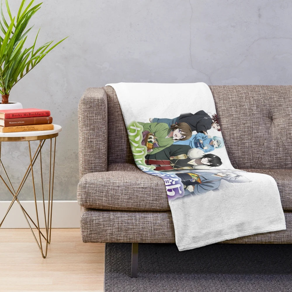 Kakuriyo-inspired plush blanket with anime design