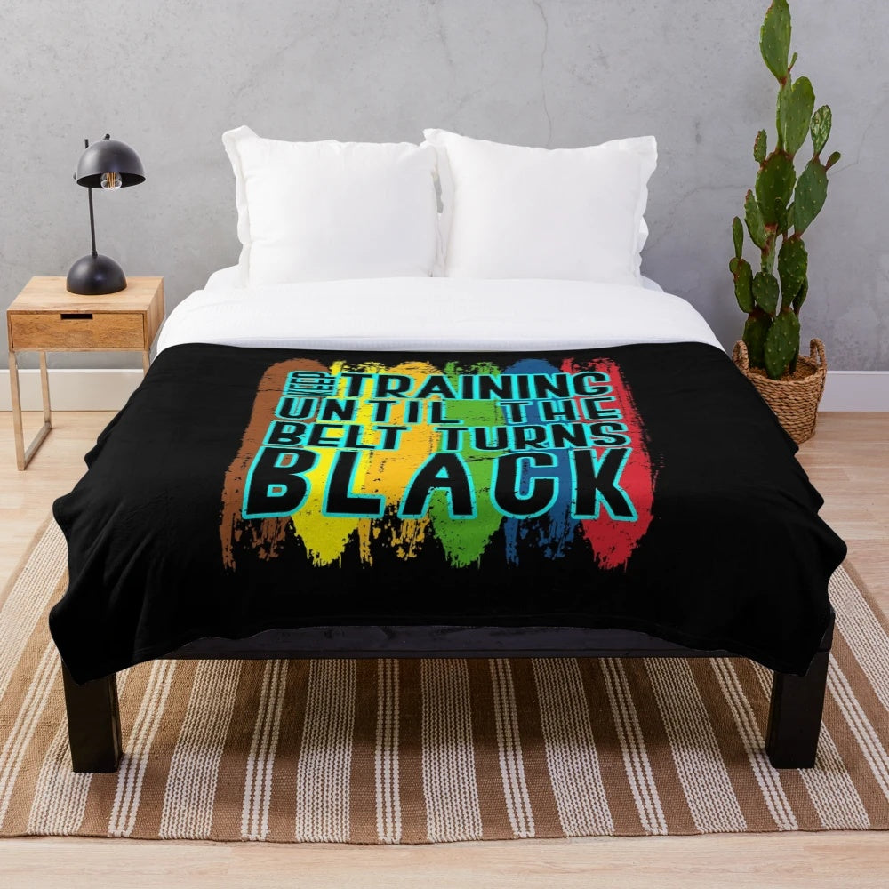 Plush blanket with karate fighter silhouette design