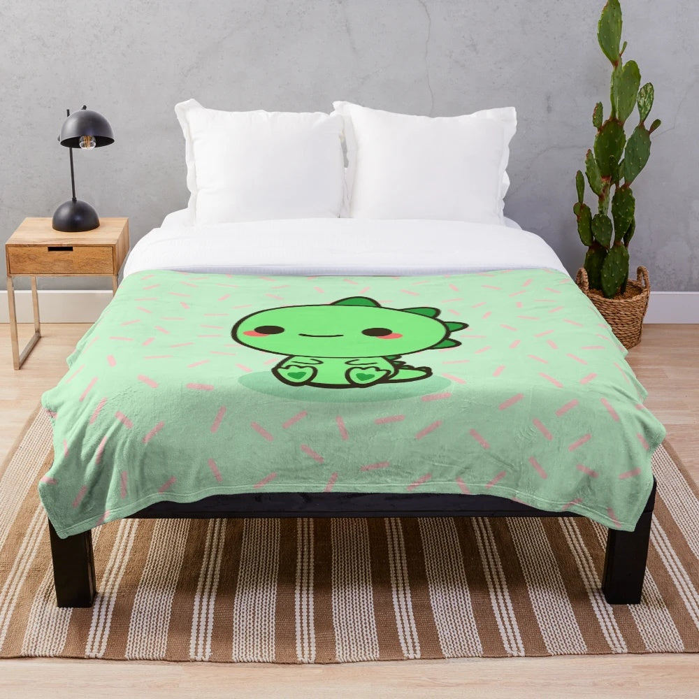 Colorful plush dinosaur blanket with kawaii design