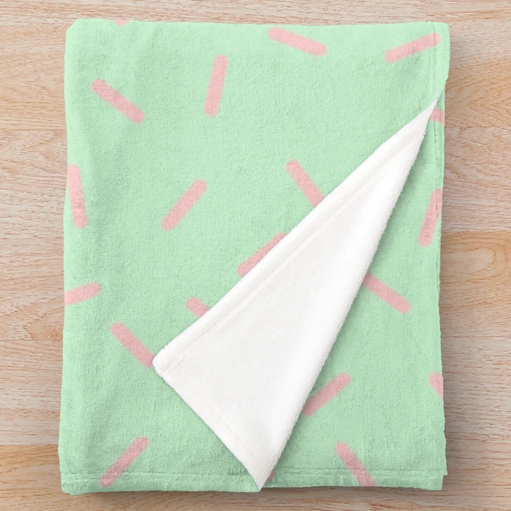 Colorful plush dinosaur blanket with kawaii design