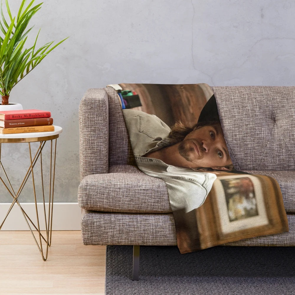 Kayce Dutton plush blanket with a cozy, western-inspired design