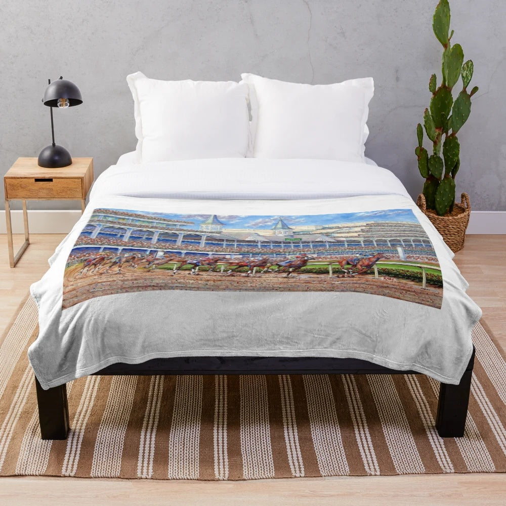 Kentucky Derby-themed plush blanket featuring horses and the Churchill Downs racetrack