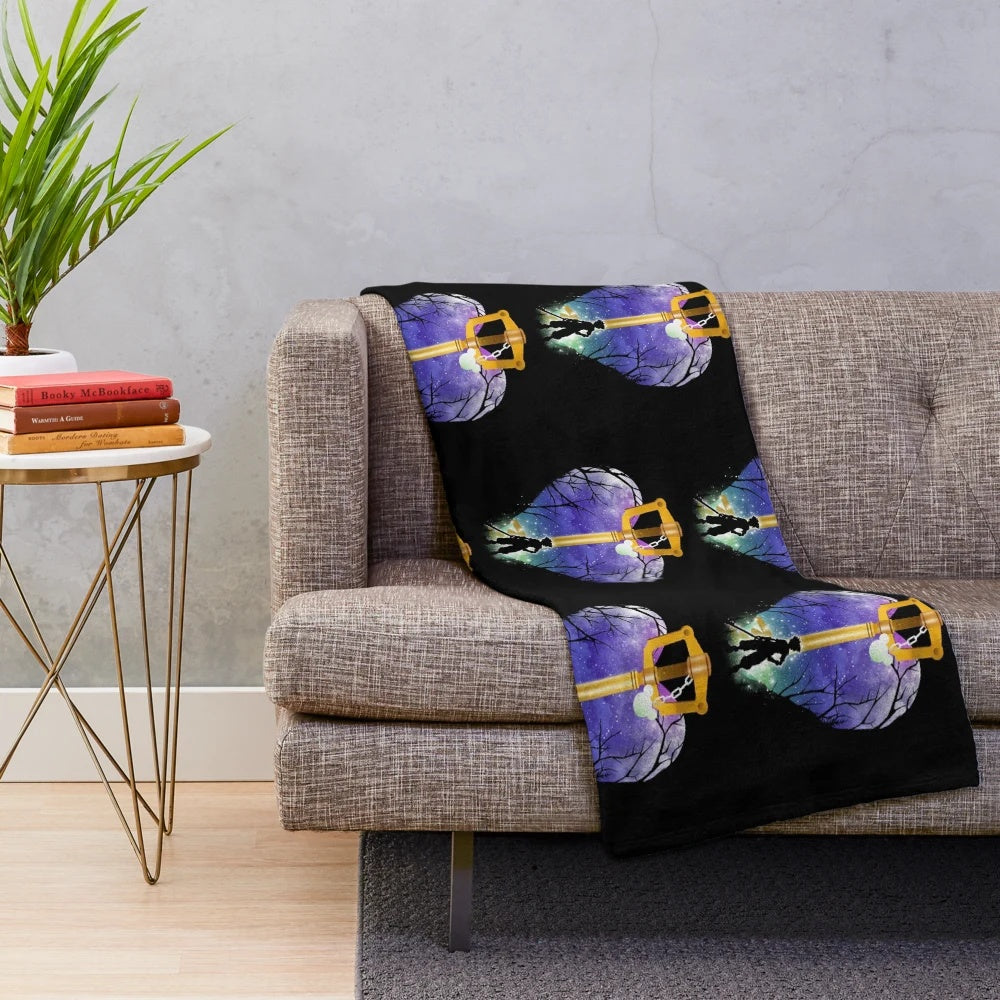 Keyblade-inspired plush blanket featuring a fantasy landscape