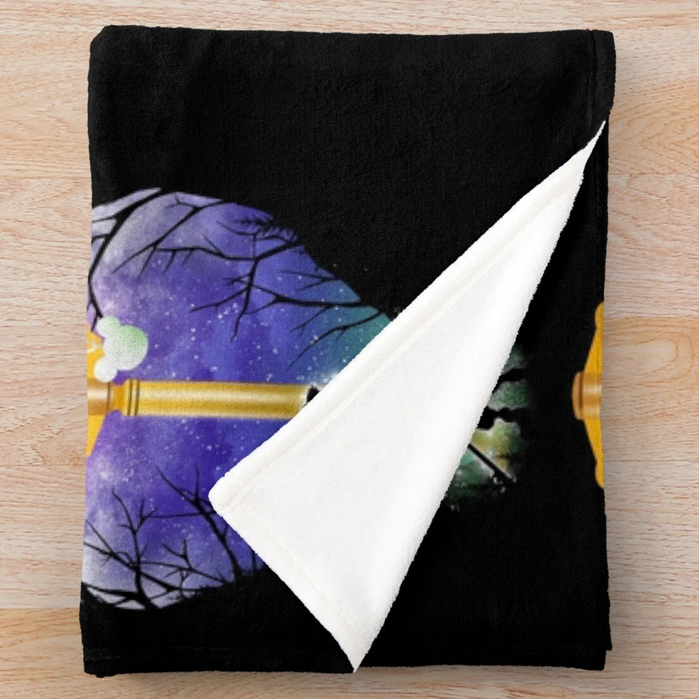 Keyblade-inspired plush blanket featuring a fantasy landscape