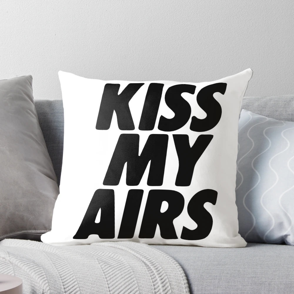 A plush, cozy pillow featuring the "Kiss My Airs" typography design, perfect for sneaker enthusiasts and hypebeast-inspired home decor.