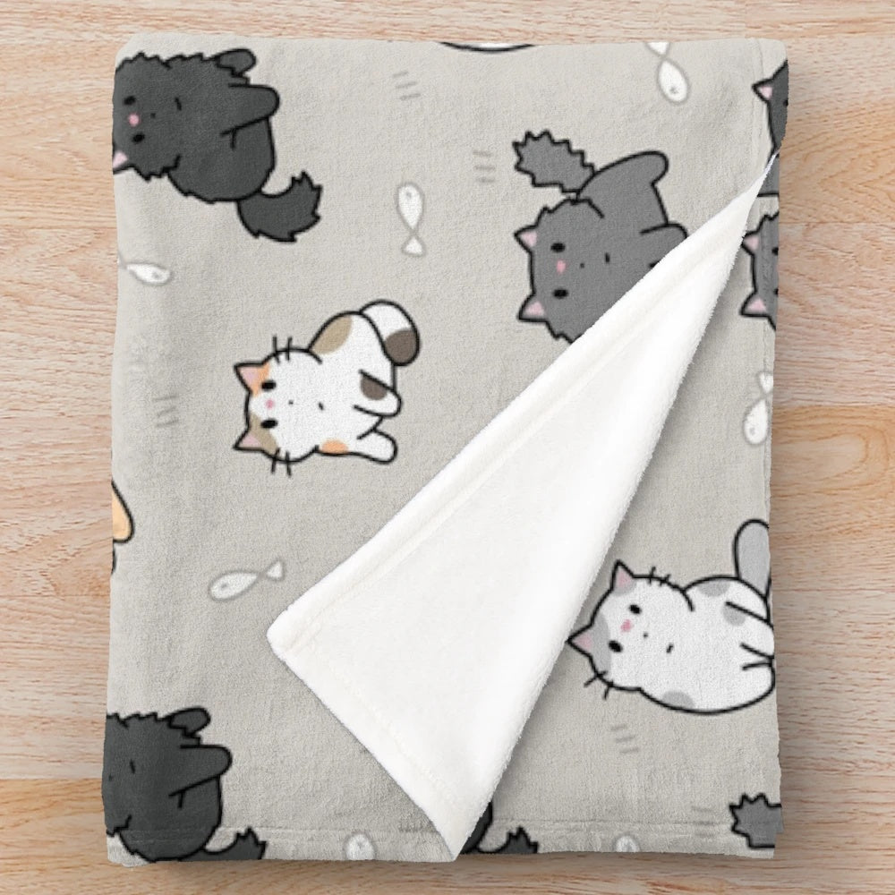 Soft and plush blanket featuring a cute kitten and fish pattern