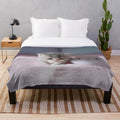 Soft, plush kitten-themed blanket in pastel colors