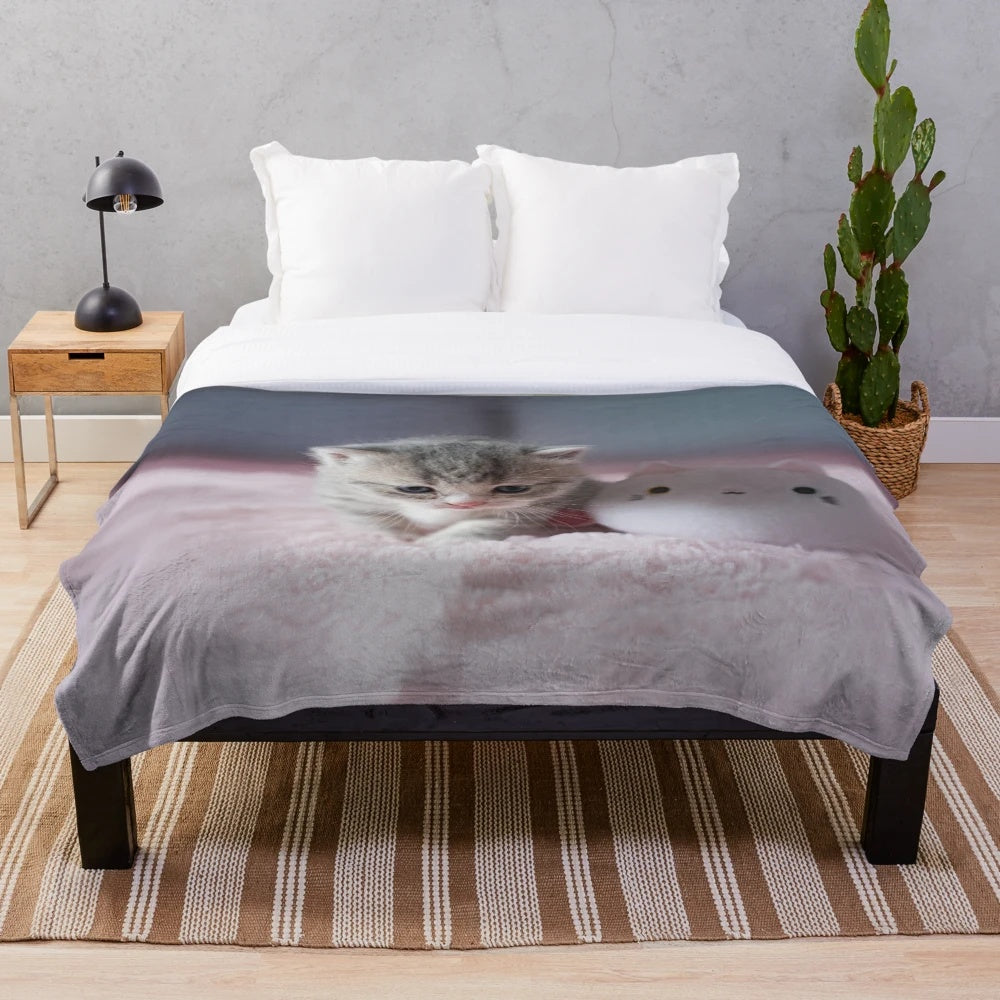 Soft, plush kitten-themed blanket in pastel colors