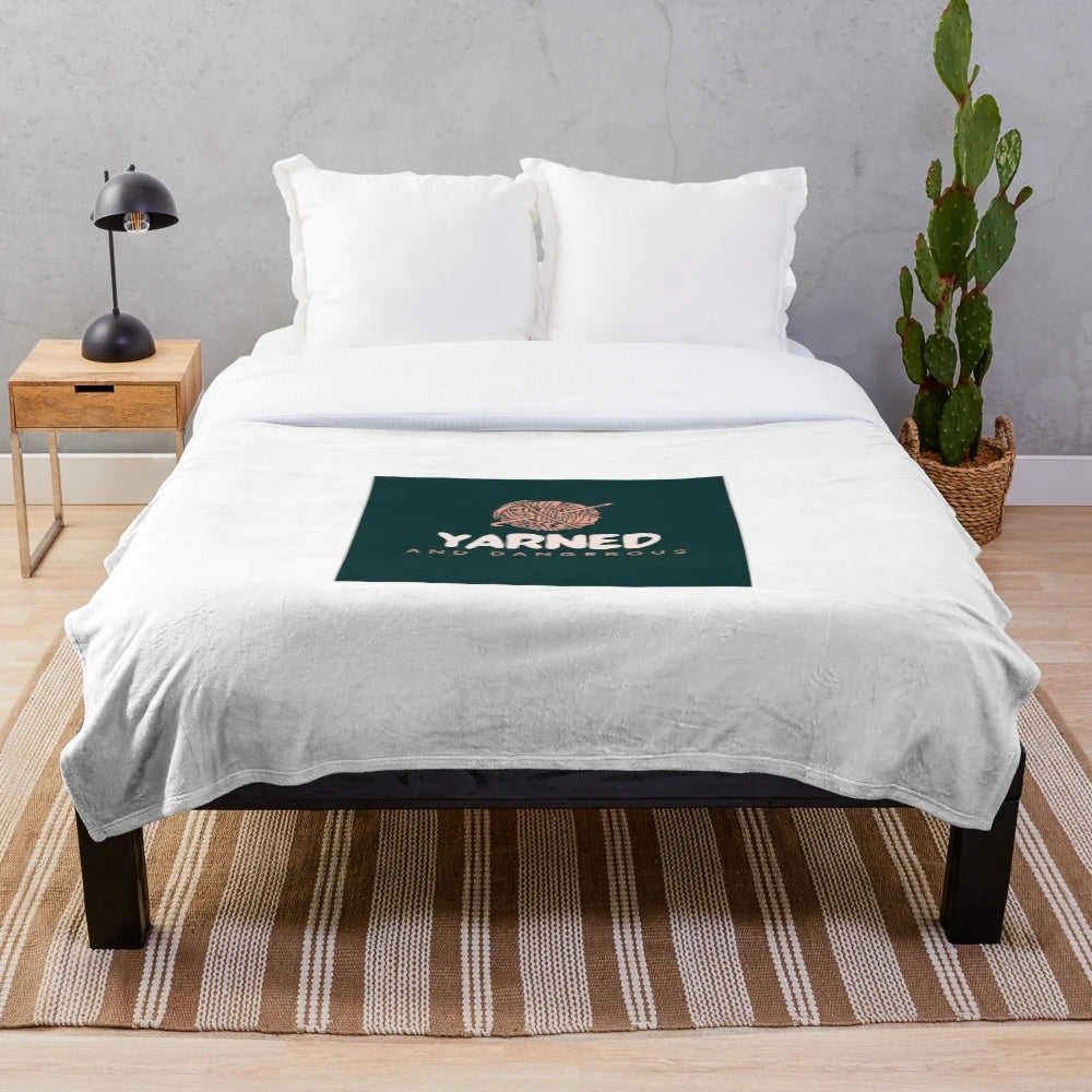 Soft and textured plush blanket with a knitted yarn design