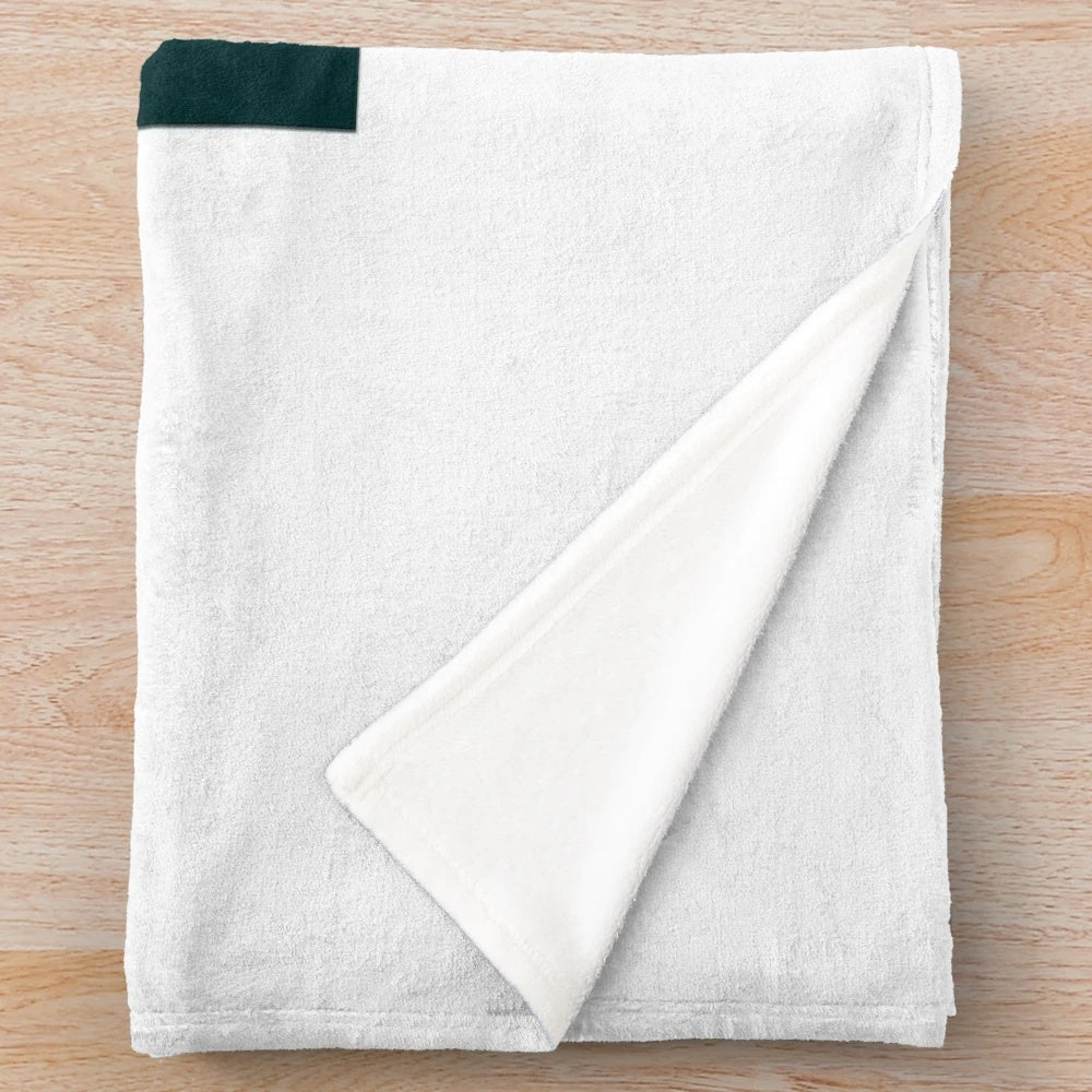 Soft and textured plush blanket with a knitted yarn design