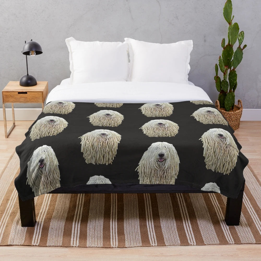 Soft and fluffy plush blanket featuring a Komondor dog breed with its distinctive dreadlock-like fur